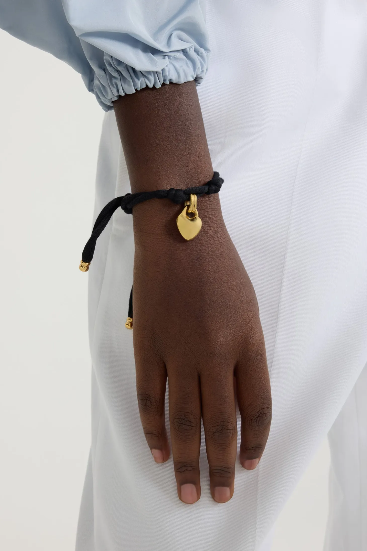 Bracelet cœur en laiton doré et coton