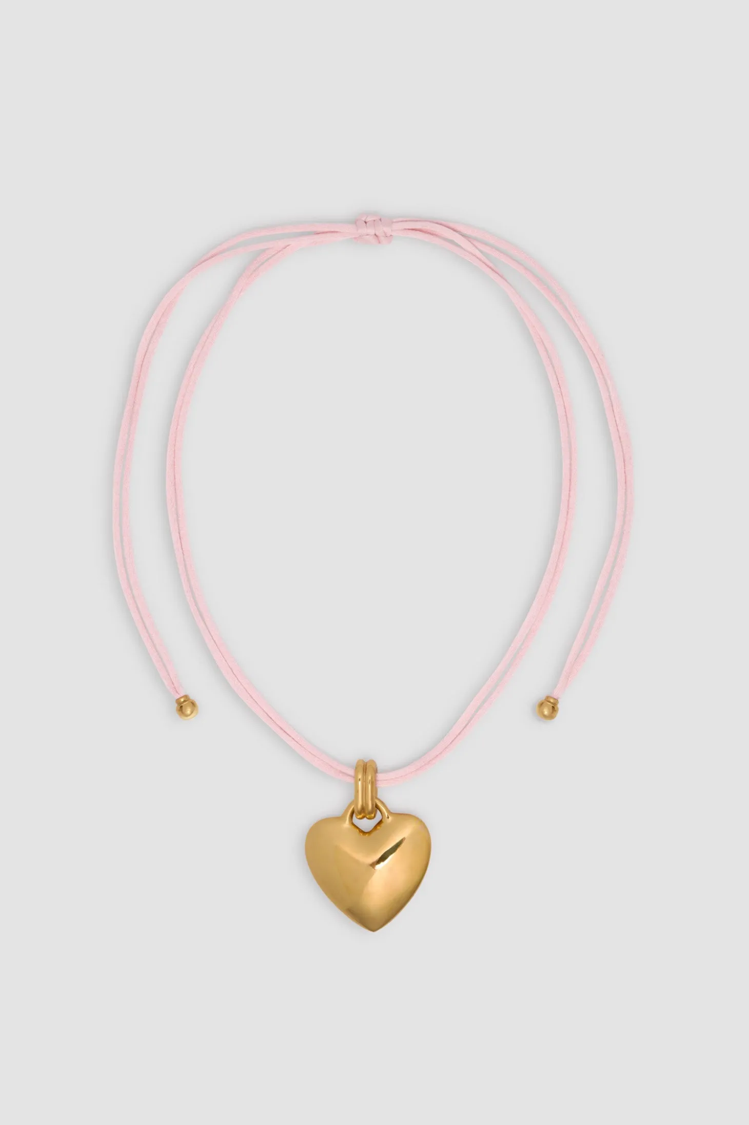 Collier à pendentif cœur en laiton doré et coton